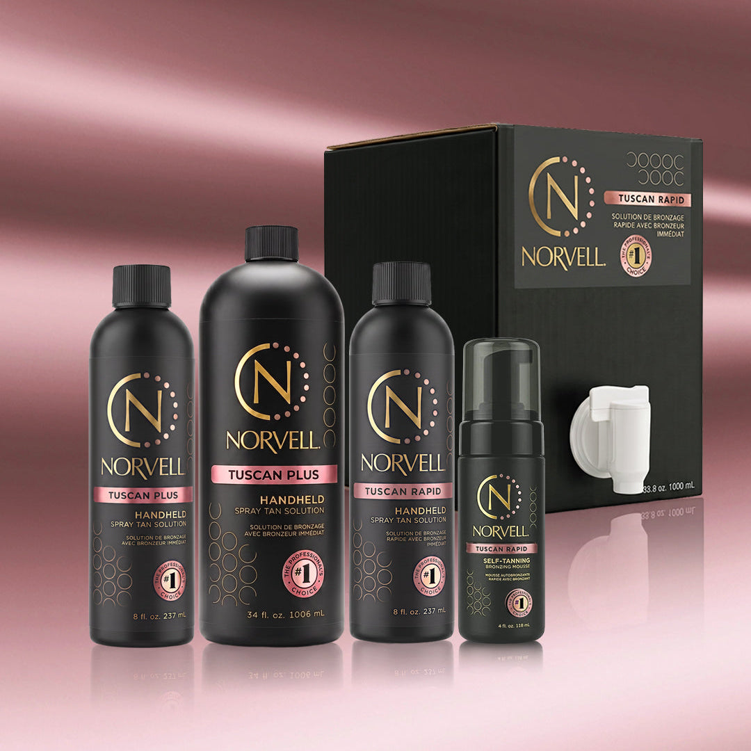 Norvell Tuscan Rapid and Tuscan Plus tanning products on a reflective surface with a rose gold background.